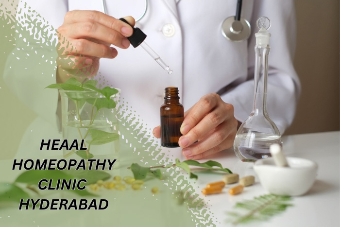 A homeopathic practitioner preparing a remedy with a dropper and amber bottle, with laboratory glassware and natural ingredients on display, showcasing the expert care at HEAAL Homeopathy Clinic in Hyderabad.
