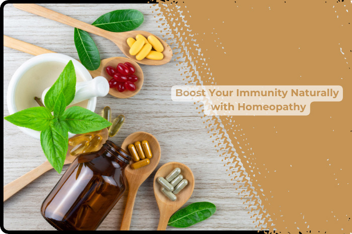 Assorted homeopathic pills and capsules in wooden spoons alongside an amber bottle of homeopathic medicine, with a cup of herbal tea, embodying natural immunity enhancement at HEAAL Homeopathy Clinic in Hyderabad.