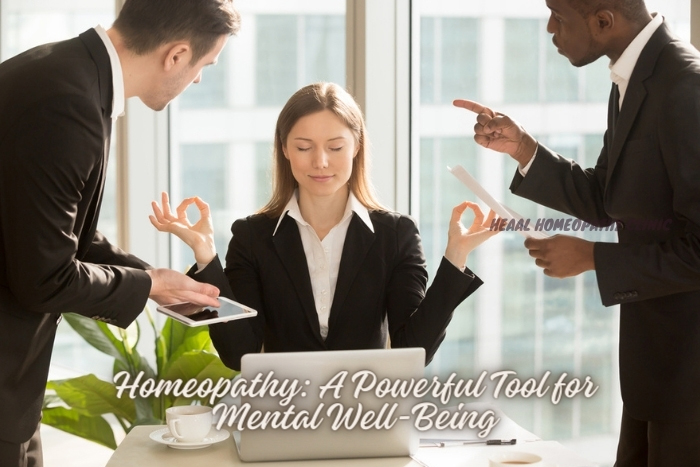 Calm businesswoman practicing mindfulness amidst busy office life, highlighting the mental health support provided by HEAAL Homeopathy Clinic in Chanda Nagar, Hyderabad