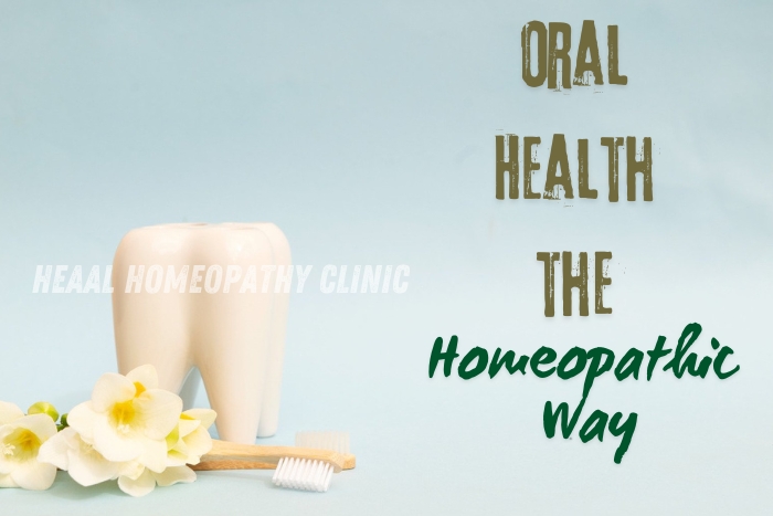 Promoting oral health the homeopathic way at HEAAL Homeopathy Clinic in Chanda Nagar, Hyderabad, with a visual featuring a tooth model and eco-friendly toothbrush surrounded by fresh flowers.