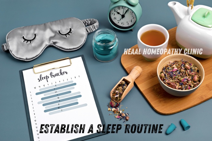 Image showcasing a sleep routine setup with a sleep mask, sleep tracker, herbal tea, and aromatherapy candle. HEAAL Homeopathy Clinic in Chanda Nagar, Hyderabad offers natural remedies to help you establish a healthy sleep routine for better overall wellness