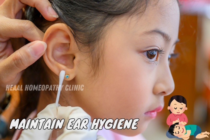 Close-up of a child's ear being gently cleaned with a cotton swab, emphasizing the importance of maintaining ear hygiene. HEAAL Homeopathy Clinic in Chanda Nagar, Hyderabad offers expert advice on ear care and homeopathic treatments for ear-related issues.